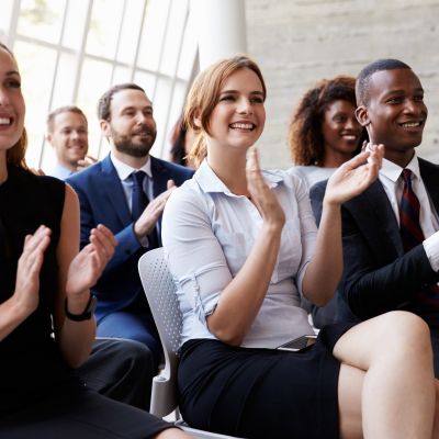 Audience-applauding-at-business-conference