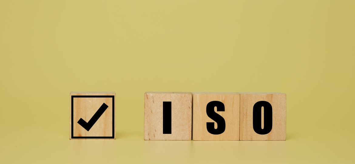 A,Picture,Of,Tick,And,Iso,Word,On,Wooden,Block.