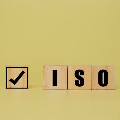 A,Picture,Of,Tick,And,Iso,Word,On,Wooden,Block.