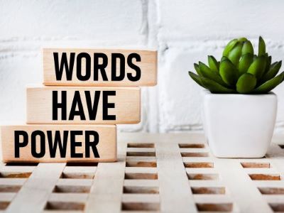 Words Have Power blocks with plant, representing how to make content accessible through clear communication translation office Berlin
